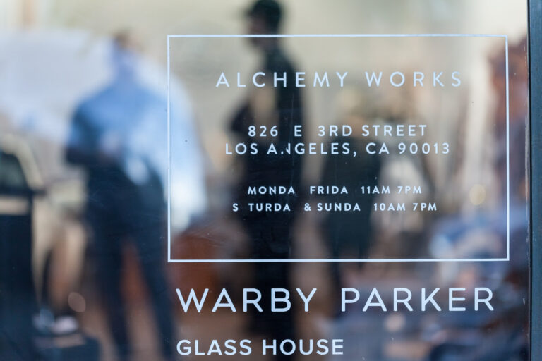 Storefront glass reads Alchemy Works at 826 E 3rd Street in Los Angeles and Warby Parker Glass House.